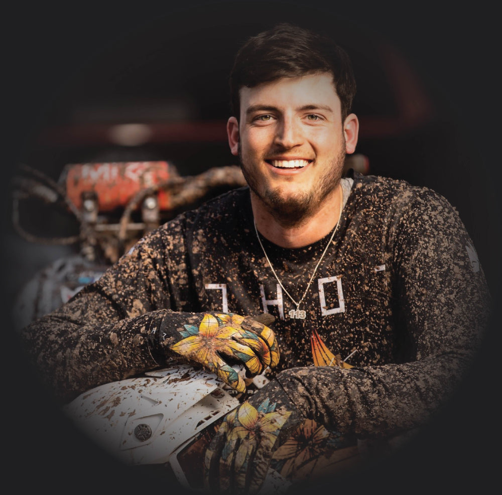 Ty Gehman in riding gear with his quad